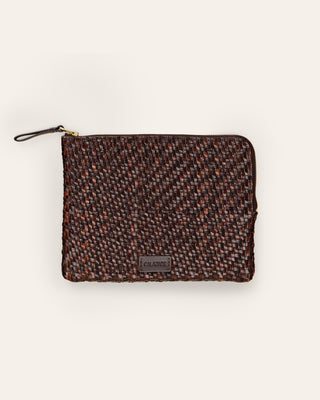 Cala Jade medium sized umber brown leather pouch on a beige background