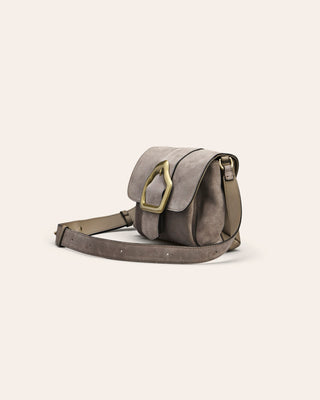 Cala Jade gray leather bag with a strap on a light beige background