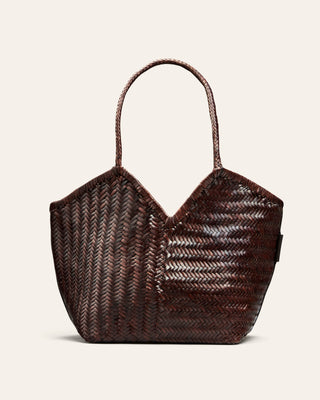 Brown woven handbag on a light beige background
