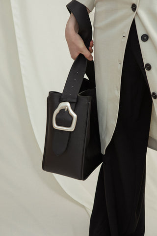 Cala Jade Masago black leather tote bag on model 3