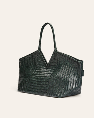 Dark Green woven handbag on a beige background