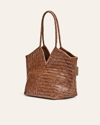 Brown woven handbag on a beige background