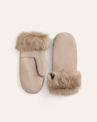 Pair of beige sherling mittens with fur cuffs on a white background