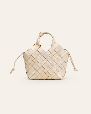 Cala Jade Misu handwoven leather bag on a beige background