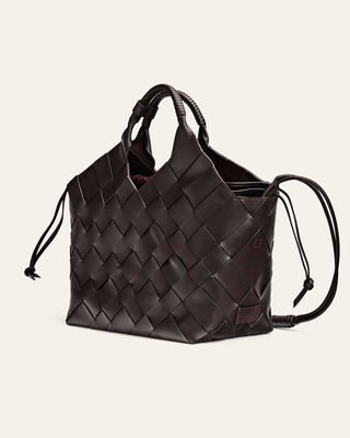 Cala Jade MISU L umber brown braided shoulder bag on a beige background