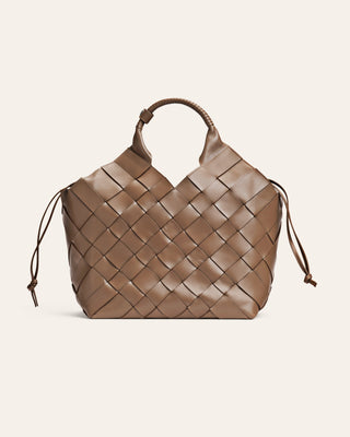 Brown woven handbag on a light beige background
