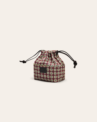 Small plaid drawstring pouch on a light beige background