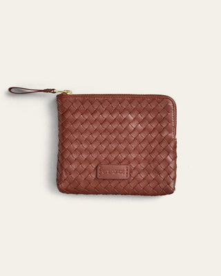 Brown woven pouch with a visible brand logo on a light beige background
