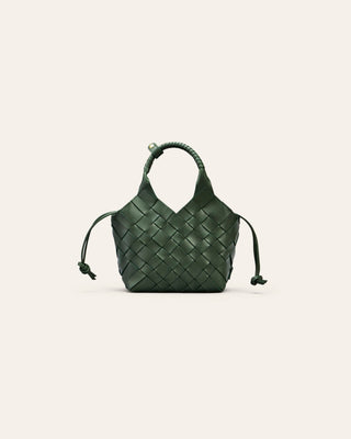 Cala Jade Misu mini Green woven handbag on a light beige background