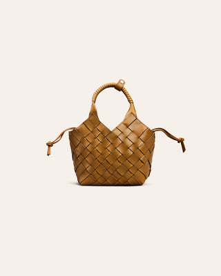 Woven handbag on a light beige background