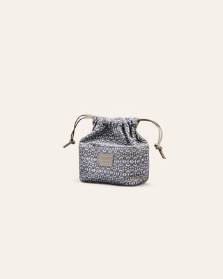 Cala JadeSmall drawstring cotton innerbag with pattern on a light gray background
