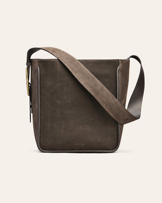Brown leather crossbody bag on a white background