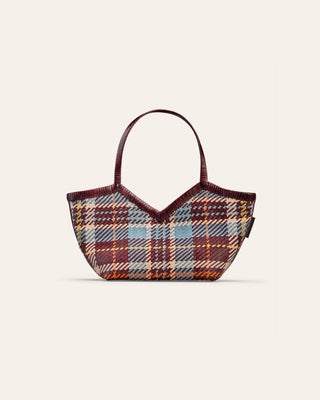 Patterned leather shoulder on a beige background