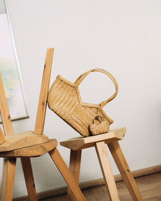two bags on w wooden chair
