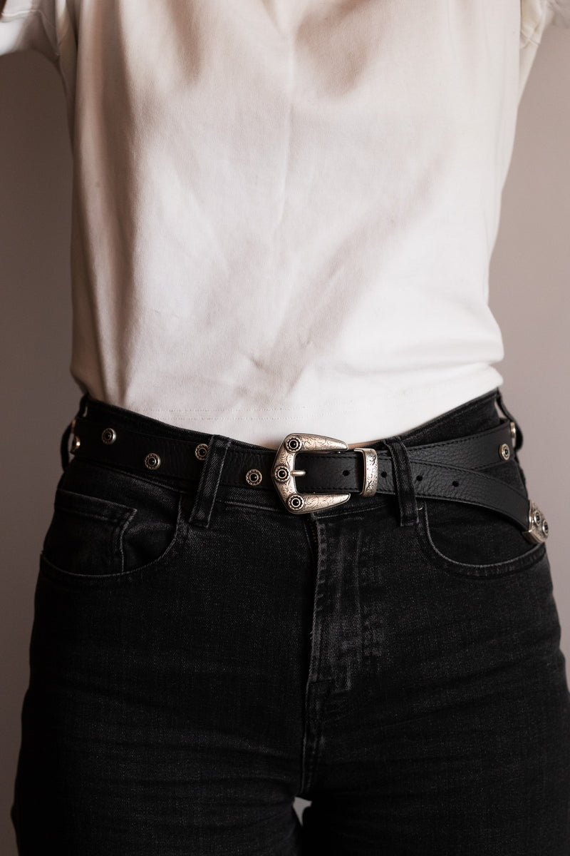 Cala Jade black leather belt with studs on model