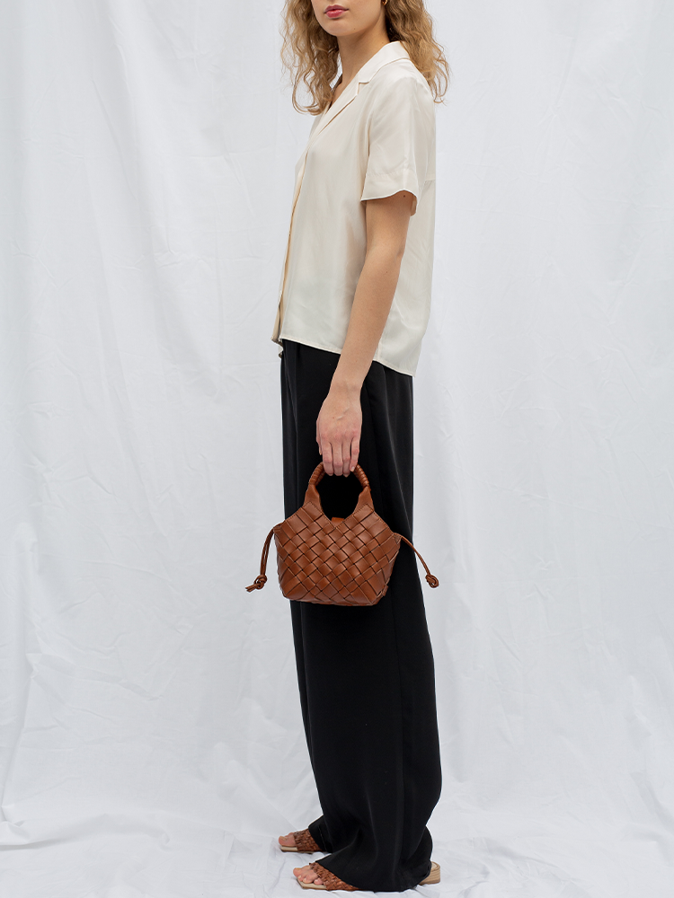 Cala Jade brown leather cross-body bag on model