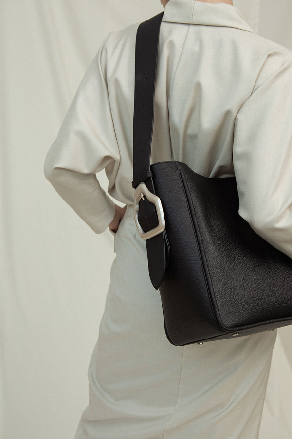 Cala Jade Masago black leather tote bag on model
