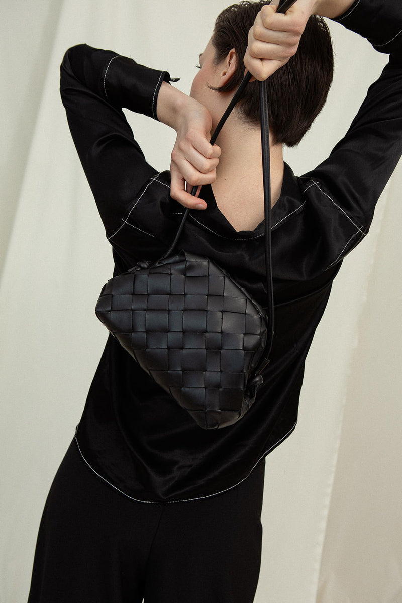 Cala Jade black clutch bag on model